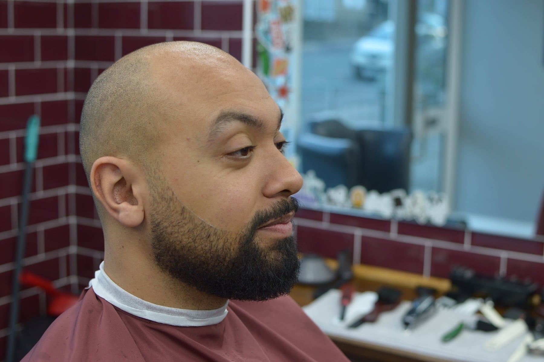 Short haircut with a full shaped beard