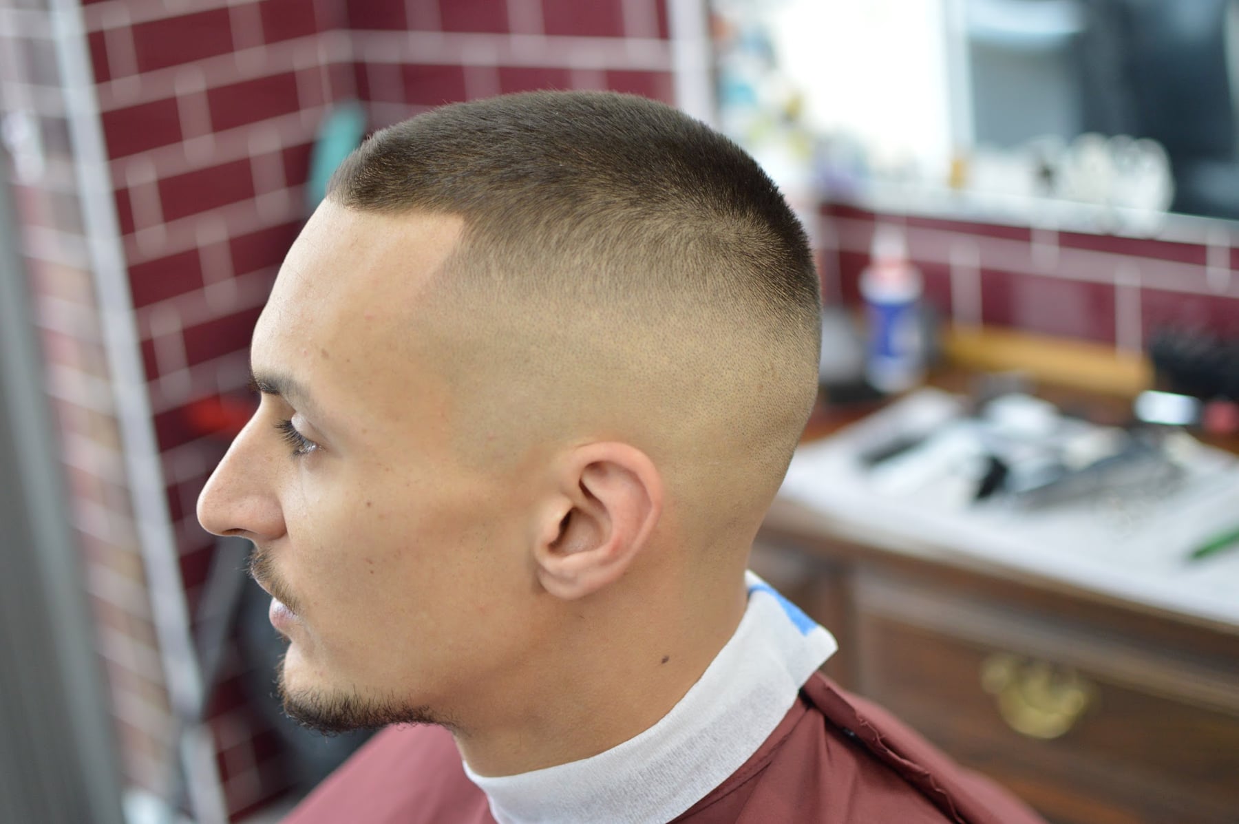 Close sides and short textured dark hair